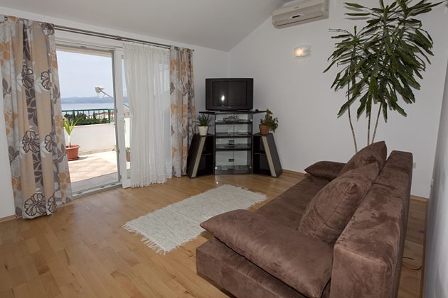 living room, tv set, view on the sea